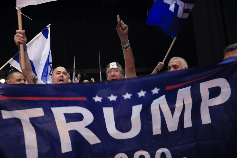 Israeli Prime Minister Benjamin Netanyahu supporters chant as the await results of the elections in Tel Aviv, Israel, Tuesday, Sept. 17, 2019. (AP Photo/Tsafrir Abayov)