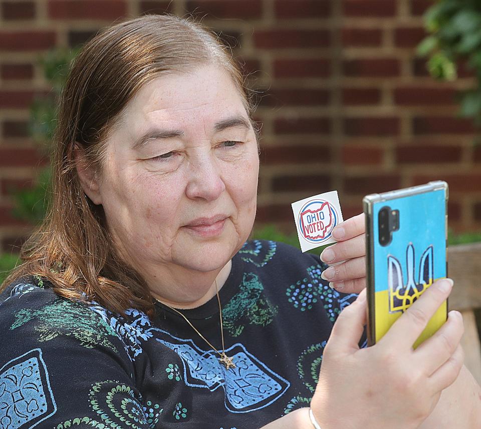 Susan Baranoff takes a selfie photo with her voting sticker on Tuesday, August 8, 2023 in Akron, Ohio, at St. Paul's Episcopal Church.