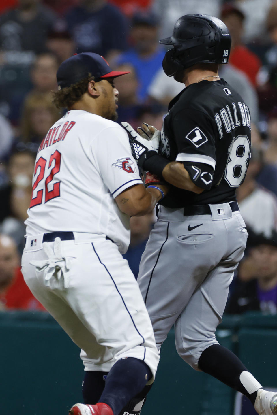Cleveland Guardians first baseman Josh Naylor, left, tags out Chicago White Sox's AJ Pollock during the first inning of a baseball game Saturday, Aug. 20, 2022, in Cleveland. (AP Photo/Ron Schwane)