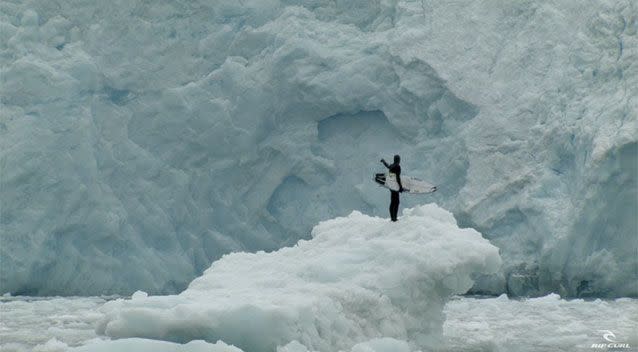 Fanning stands on ice in the water. Source: Rip Curl