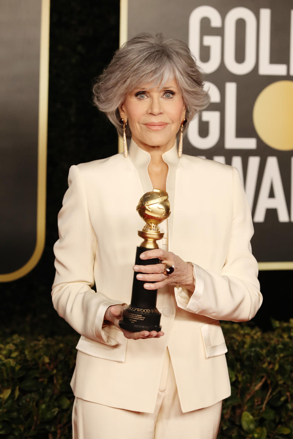 Jane Fonda holds her Cecil B. DeMille Award at the 2021 Golden Globe Awards ceremony