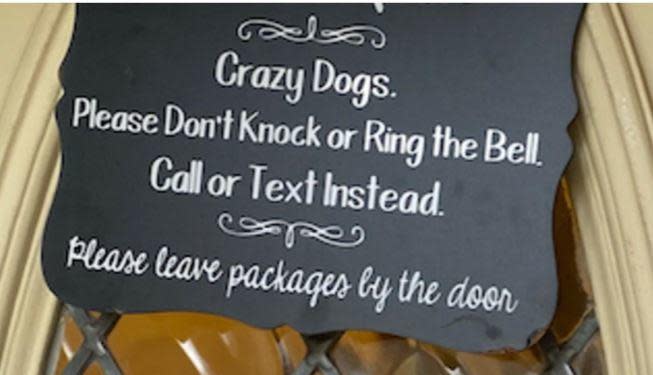 A sign on the front door read 'Crazy Dogs. Please Don't Knock or Ring the Bell,