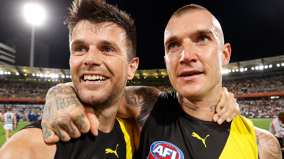 Richmond's Trent Cotchin and Dustin Martin are pictured celebrating together after the 2020 AFL grand final.