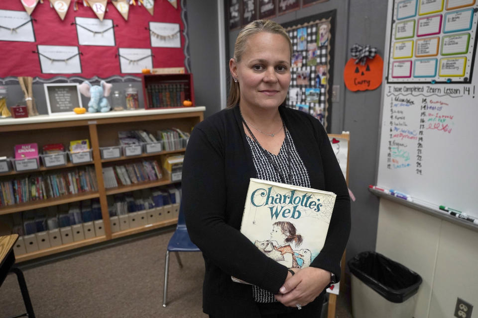 Teacher Sarah Curry stands for a portrait in her fourth grade classroom in rural Hickman, Calif., on Tuesday, Oct. 18, 2022. “Should we have reopened earlier? Absolutely,” says Curry. She initially favored school closings in her rural Central Valley district, but grew frustrated with the duration of distance learning. She taught pre-kindergarten and found it impossible to maintain attention spans online. (AP Photo/Rich Pedroncelli)