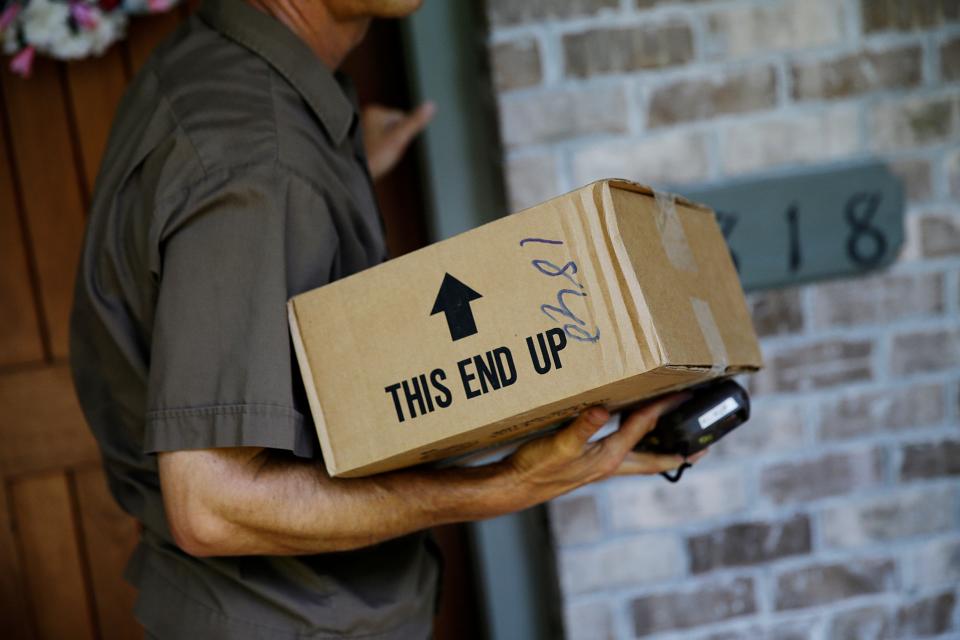 United Parcel Service driver makes a delivery in Cumming, Ga.