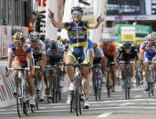 FILE PHOTO: Vacansoleil's team rider Borut Bozic of Slovenia (R) celebrates winning ahead of Rabobank's team rider Oscar Freire of Spain the fifth stage of the Tour de Suisse cycling race in Tobel-Taegerschen June 15, 2011. REUTERS/Denis Balibouse