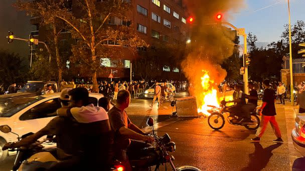 PHOTO: A police motorcycle burns during a protest over the death of Mahsa Amini, a woman who died after being arrested by the Islamic republic's 'morality police', in Tehran, Iran, Sept. 19, 2022. (Wana News Agency via Reuters, FILE)