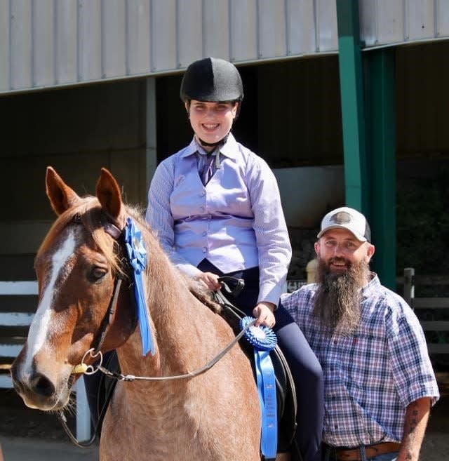 Savannah Heavner, riding Roanie, pictured with her father, Ricky Heavner, competed in two horseback riding competitions and brought home honors.