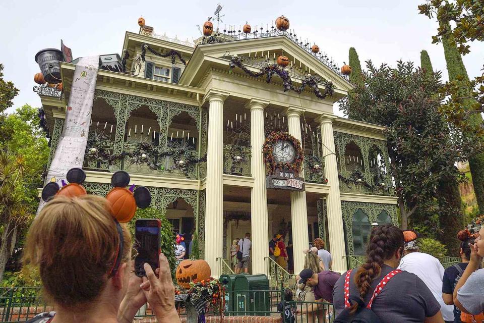 <p>Jeff Gritchen/MediaNews Group/Orange County Register via Getty</p> Haunted Mansion during Halloween in 2021. 