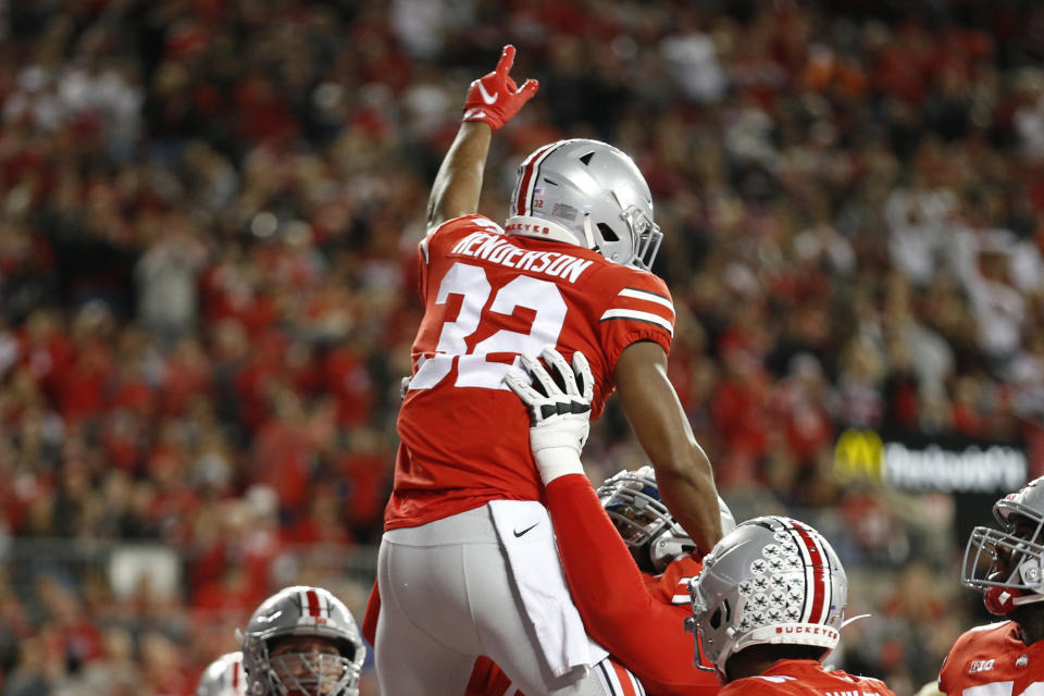 Ohio State running back TreVeyon Henderson, top, celebrates his touchdown against Akron during the first half of an NCAA college football game Saturday, Sept. 25, 2021, in Columbus, Ohio. (AP Photo/Jay LaPrete)