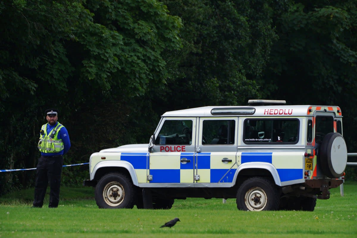 Police at the scene in the Sarn area of Bridgend, south Wales, near to where five-year-old Logan Mwangi was found dead in the Ogmore River on Saturday. Picture date: Tuesday August 3, 2021. (PA Archive)