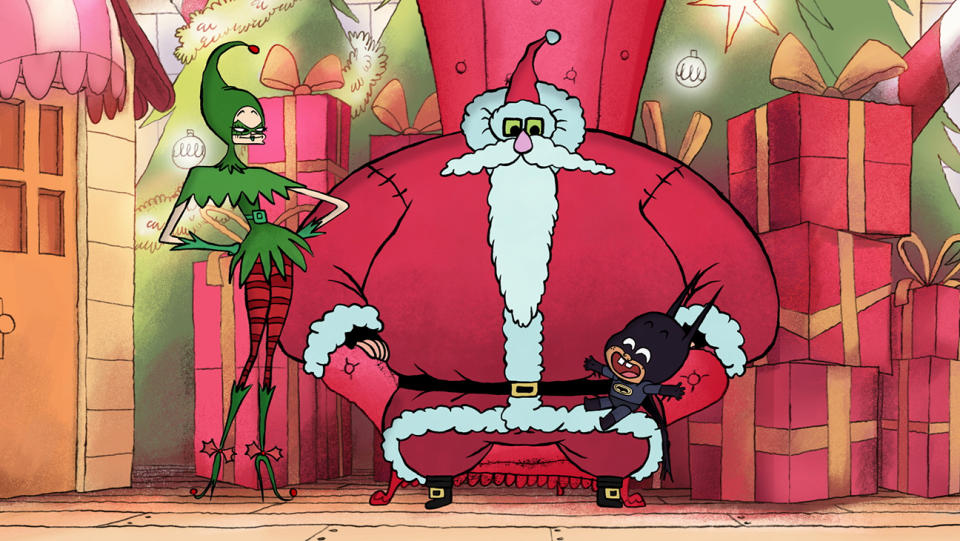 An elf, Santa Claus and Damian at the mall in Merry Little Batman.