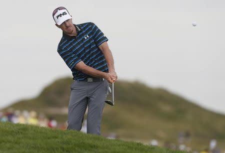 Hunter Mahan chips onto the 16th green during the first round of the 2015 PGA Championship golf tournament at Whistling Straits. Mandatory Credit: Brian Spurlock-USA TODAY Sports