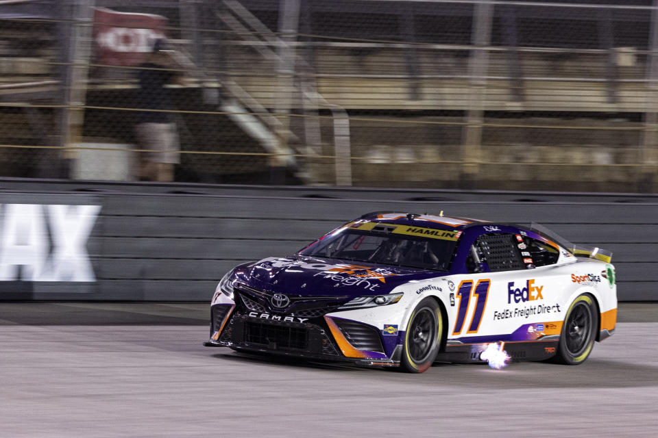 Denny Hamlin (11) drives along the back stretch during the NASCAR Cup Series auto race Saturday, Sept. 16, 2023, in Bristol, Tenn. (AP Photo/Wade Payne)