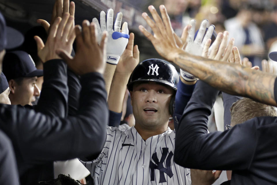 New York Yankees' Isiah Kiner-Falefa is congratulated for his grand slam against the Minnesota Twins during the fourth inning of the second baseball game of a doubleheader Wednesday, Sept. 7, 2022, in New York. (AP Photo/Adam Hunger)
