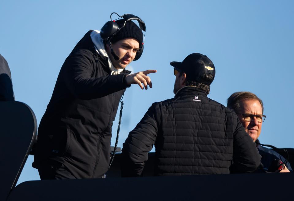 NASCAR Cup Series driver Noah Gragson (left) talks to teammate and Legacy Motor Club co-owner Jimmie Johnson during testing at Phoenix Raceway. Mandatory Credit: Mark J. Rebilas-USA TODAY Sports