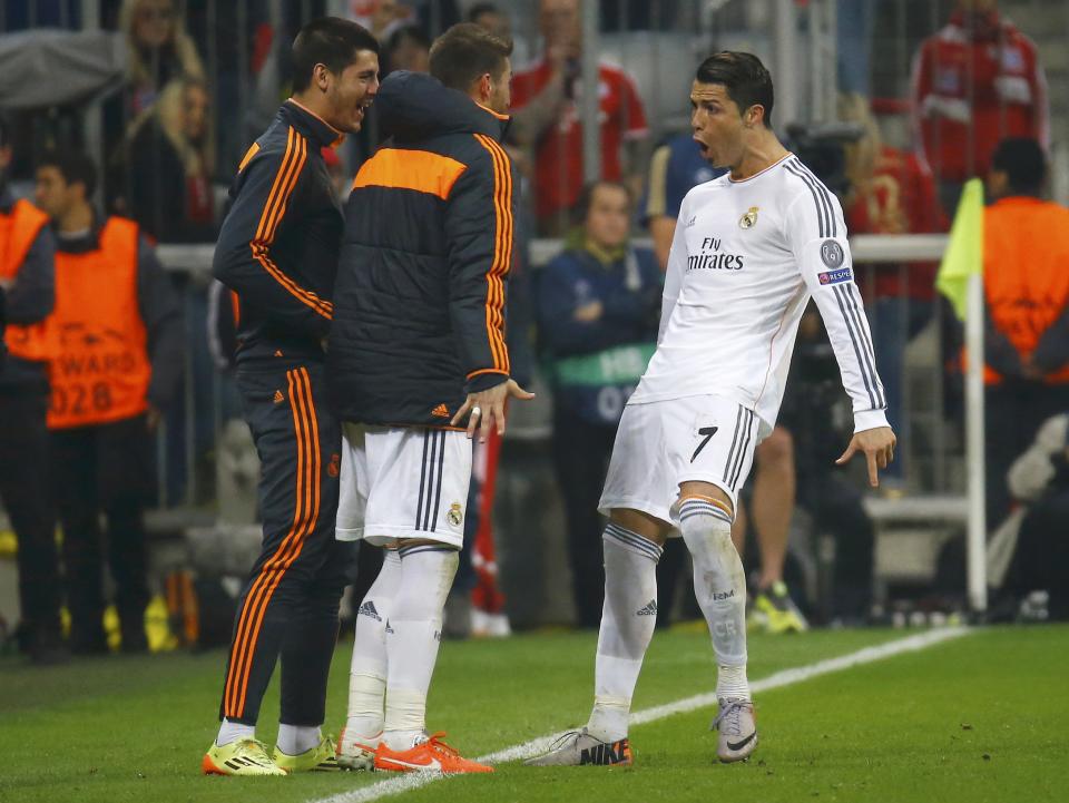 Real Madrid's Cristiano Ronaldo celebrates his second goal against Bayern Munich in front of teammates during their Champions League semi-final second leg soccer match in Munich