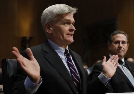 U.S. Senator Bill Cassidy testifies next to former Senator Rick Santorum during a Senate Finance Committee hearing on the Graham Cassidy bill to repeal and replace the Affordable Care Act on Capitol Hill in Washington, U.S. September 25, 2017. REUTERS/Kevin Lamarque