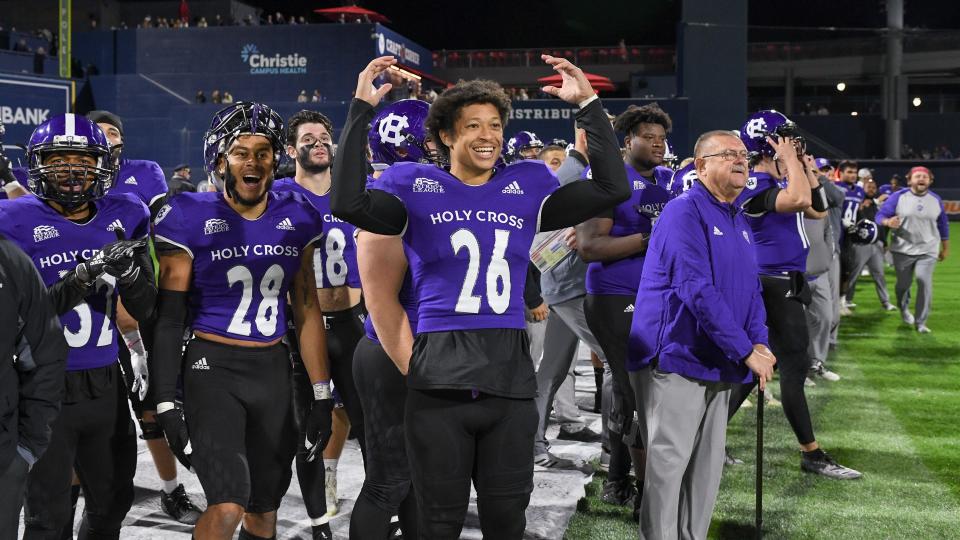 Holy Cross safety Walter Reynolds celebrates a big play by the Crusaders during last year's win over Colgate at Polar Park.