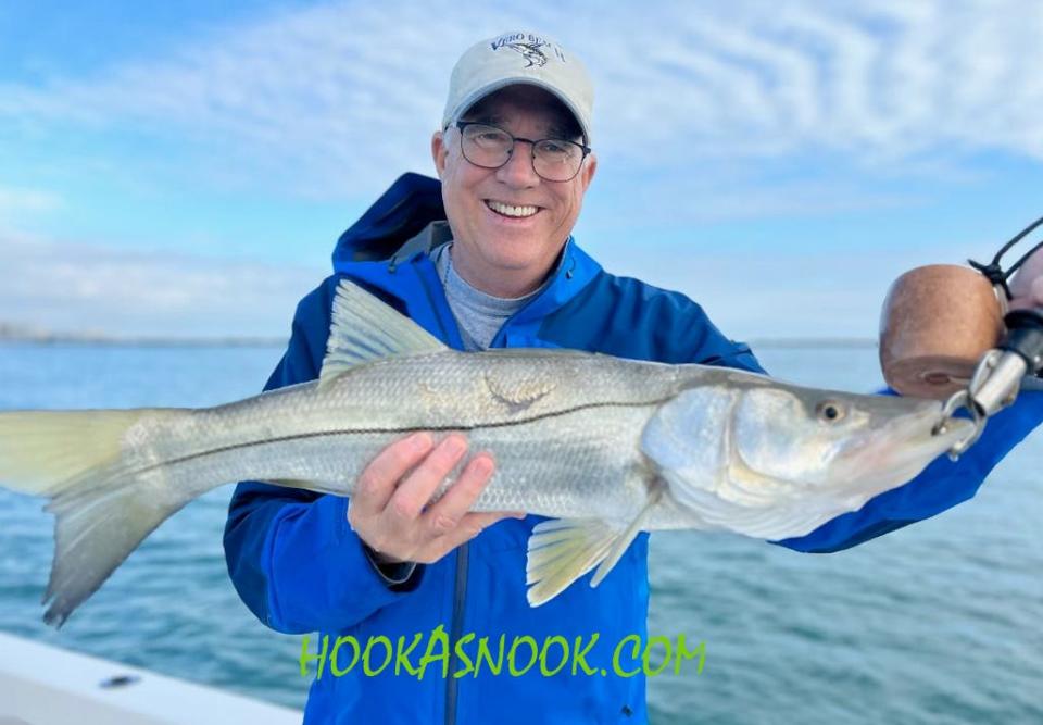 This angler proudly displays his fifth snook caught & released Jan. 21, 2023 in Fort Pierce while fishing with Capt. Tim Simos of HookASnook.com.