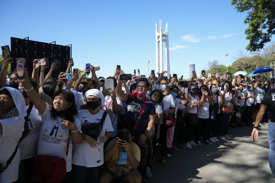 Supporters of Quezon City Mayor Joy Belmonte waits for her arrival as she starts her re-election campaign in Quezon City, Philippines on Friday, March 25, 2022. Candidates for thousands of provincial, town and congressional posts started campaigning across the Philippines Friday under tight police watch due to a history of violent rivalries and to enforce a lingering pandemic ban on handshakes, hugging and tightly packed crowds that are a hallmark of often circus-like campaigns. (AP Photo/Aaron Favila)