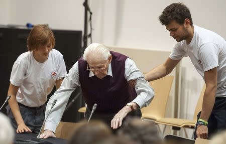 Defendant and former Nazi SS officer Oskar Groening, dubbed the "bookkeeper of Auschwitz", takes a seat in the courtroom ahead of his trial in the 'Ritterakademie' venue in Lueneburg, Germany, July 1, 2015. REUTERS/Philipp Schulze/Pool