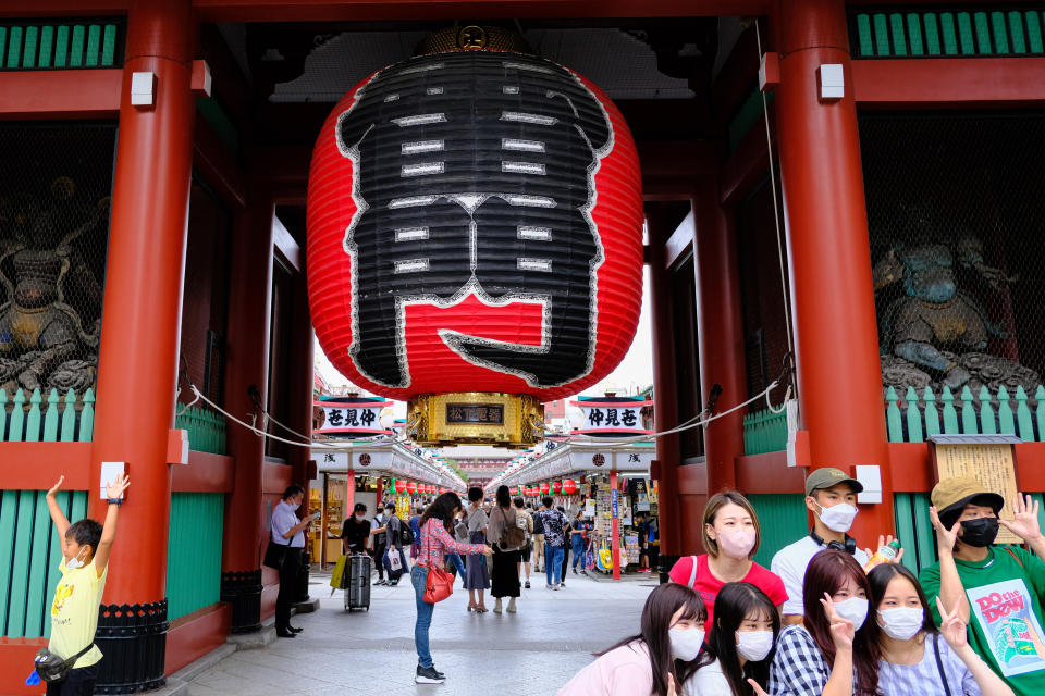 TOKYO, JAPAN - 2022/08/25: People wait in front of Kaminarimon gate for the arrival of a Mikoshi or portable shrine which is carried by truck, during Sanja Matsuri, one of Tokyo's biggest traditional festivals, taking place after months due to the Covid-19 outbreak, in Tokyo. (Photo by James Matsumoto/SOPA Images/LightRocket via Getty Images)