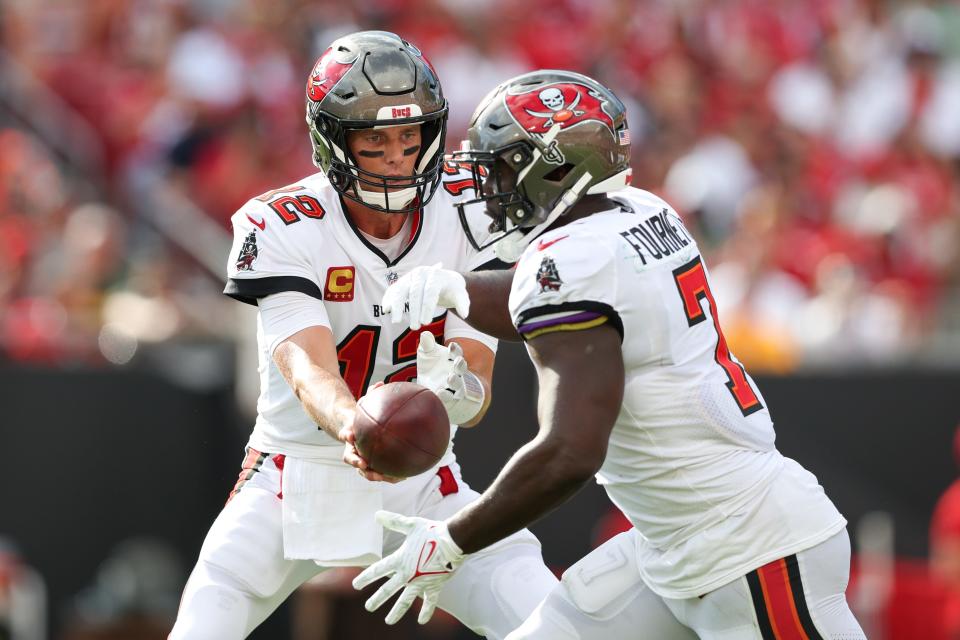 Tampa Bay Buccaneers quarterback Tom Brady (12) hands off to running back Leonard Fournette (7) during the Sept. 25 game against the Green Bay Packers.