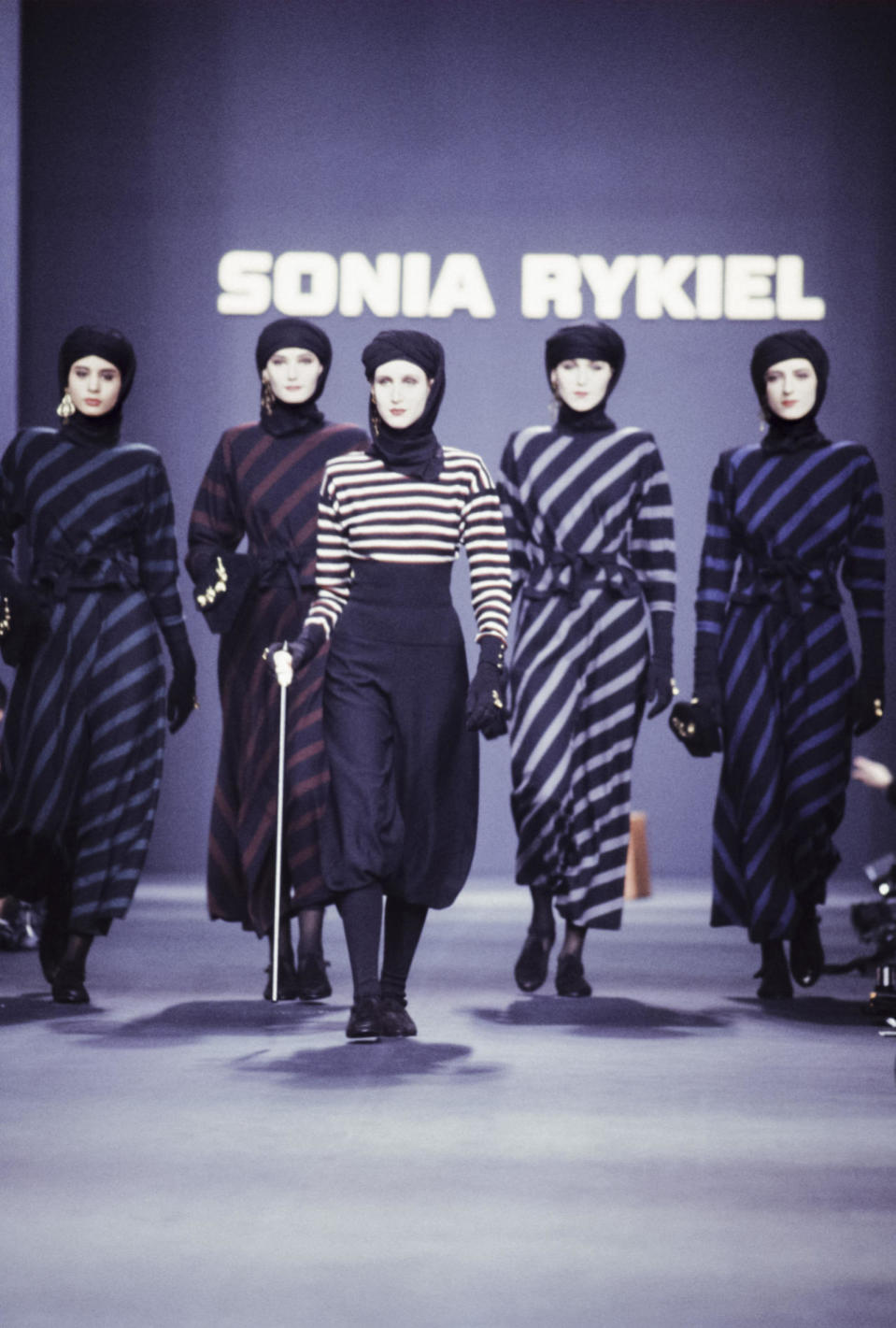 Models wear striped knit dresses at Sonia Rykiel’s fall 1989 show in Paris.