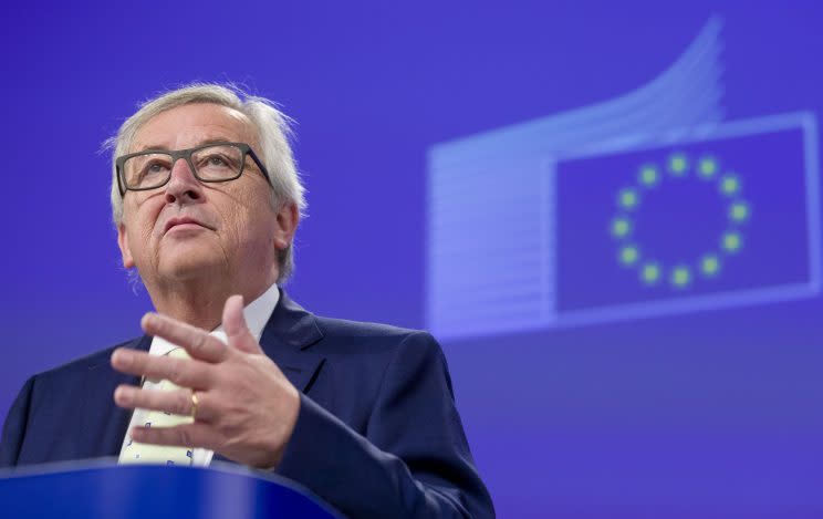 European Commission President Jean-Claude Juncker prepares to address a media conference at EU headquarters in Brussels