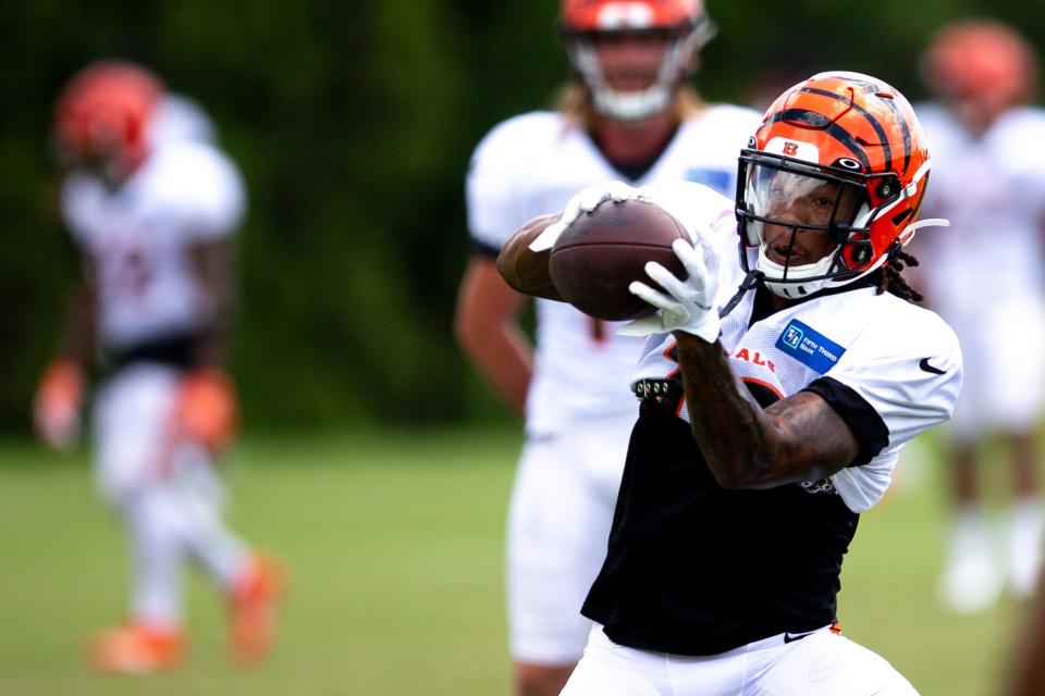 Cincinnati Bengals wide receiver Kwamie Lassiter II (18) catches a pass during preseason training camp Monday, Aug. 8, 2022. Lassiter II has been a surprise player in camp, taking reps at receiver with the first-team offense.