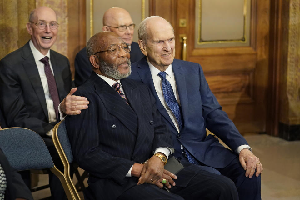 The Rev. Amos C. Brown, front left, and President Russell M. Nelson of The Church of Jesus Christ of Latter-day Saints are shown during a news conference Monday, June 14, 2021, in Salt Lake City. Top leaders from the NAACP and The Church of Jesus Christ of Latter-day Saints announced $9.25 million in new educational and humanitarian projects as they seek to build on an alliance formed in 2018. (AP Photo/Rick Bowmer)