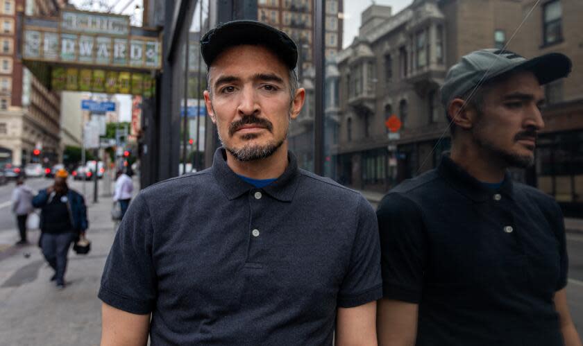 Blaine Heffron poses for a photo outside the King Edward Hotel