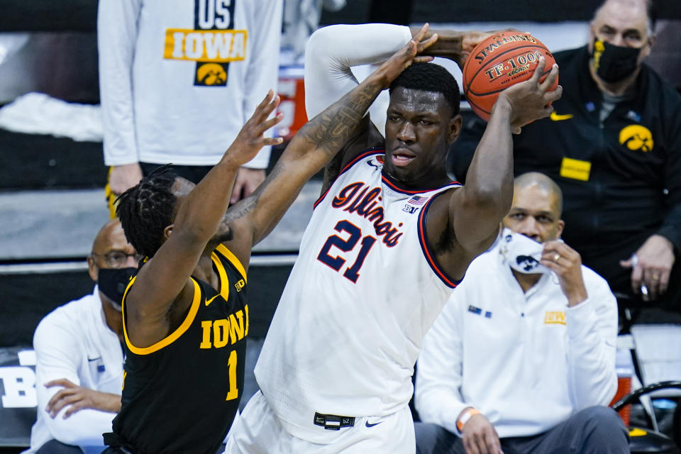 Illinois guard Trent Frazier (1) defends against Illinois center Kofi Cockburn (21) in the first half of an NCAA college basketball game at the Big Ten Conference tournament in Indianapolis, Saturday, March 13, 2021. (AP Photo/Michael Conroy)