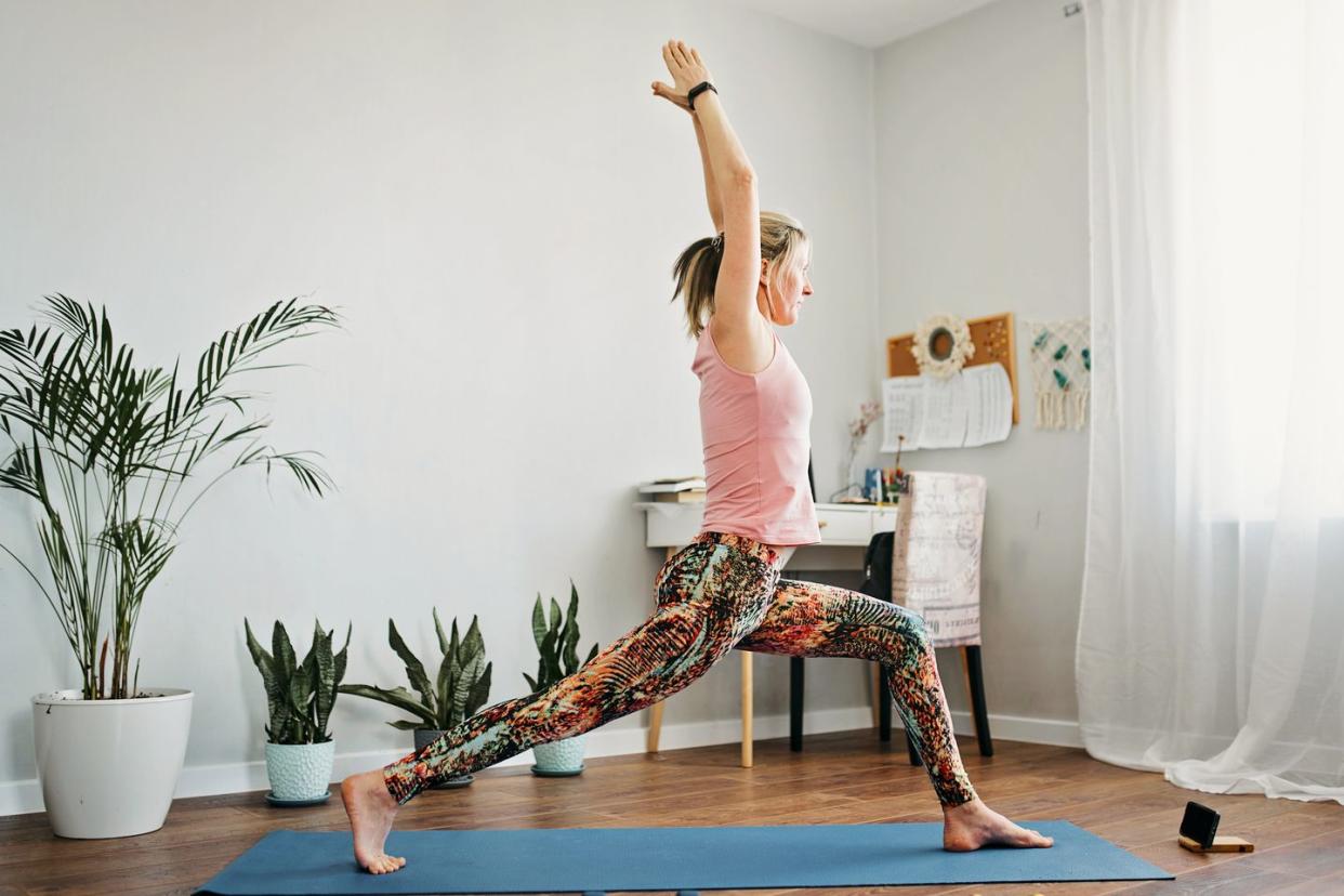 a women doing yoga in her living room