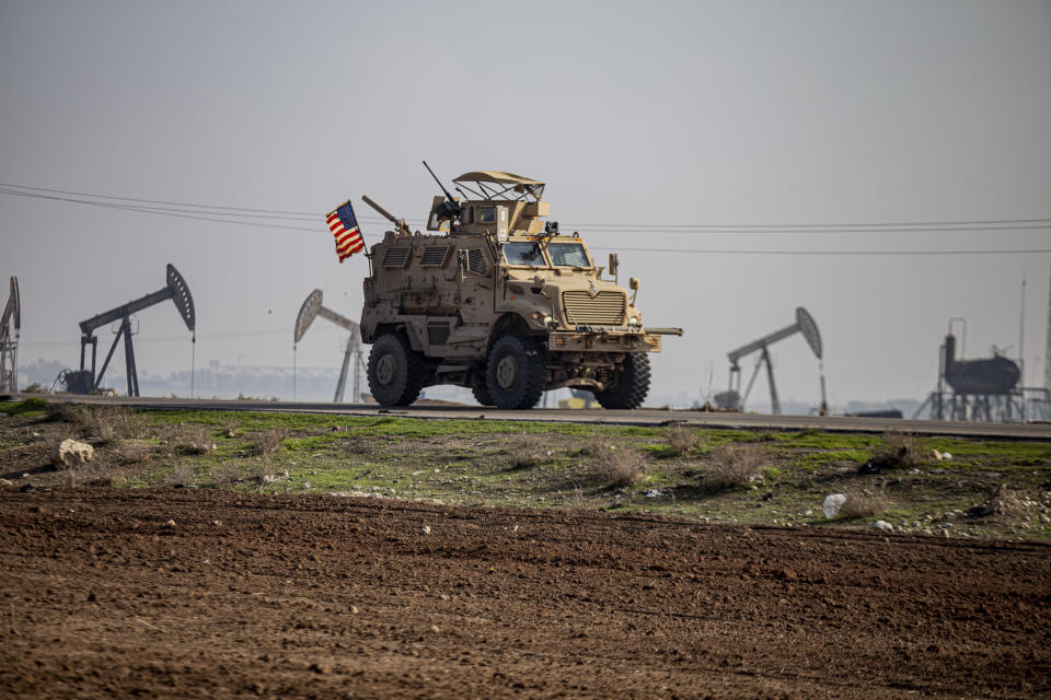 FILE - A US military vehicle on a patrol in the countryside near the town of Qamishli, Syria, Sunday, Dec. 4, 2022. U.S. and Kurdish-led forces had arrested an Islamic State group militant in eastern Syria. The Kurdish-led Syrian Democratic Forces said in a statement Monday, Dec. 19, 2022 that they raided the home of an unnamed IS militant leader in the western countryside of Deir el-Zour and arrested him. (AP Photo/Baderkhan Ahmad, File)