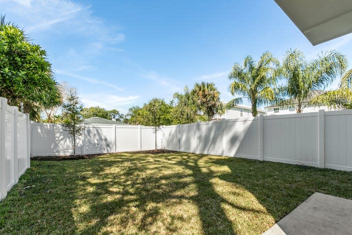 The backyard of a narrow house.