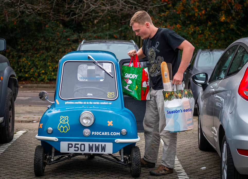 Alex  Orchin says the only thing he can fit in by the handbrake is a shopping bag. (SWNS)