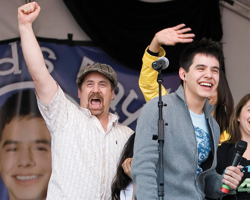 American Idol contestant David Archuleta, and his father, Jeff Archuleta, celebrate before a performance at David’s high school Friday, May 9, 2008, in Murray, Utah. (AP Photo/Kenny Crookston) - Credit: AP