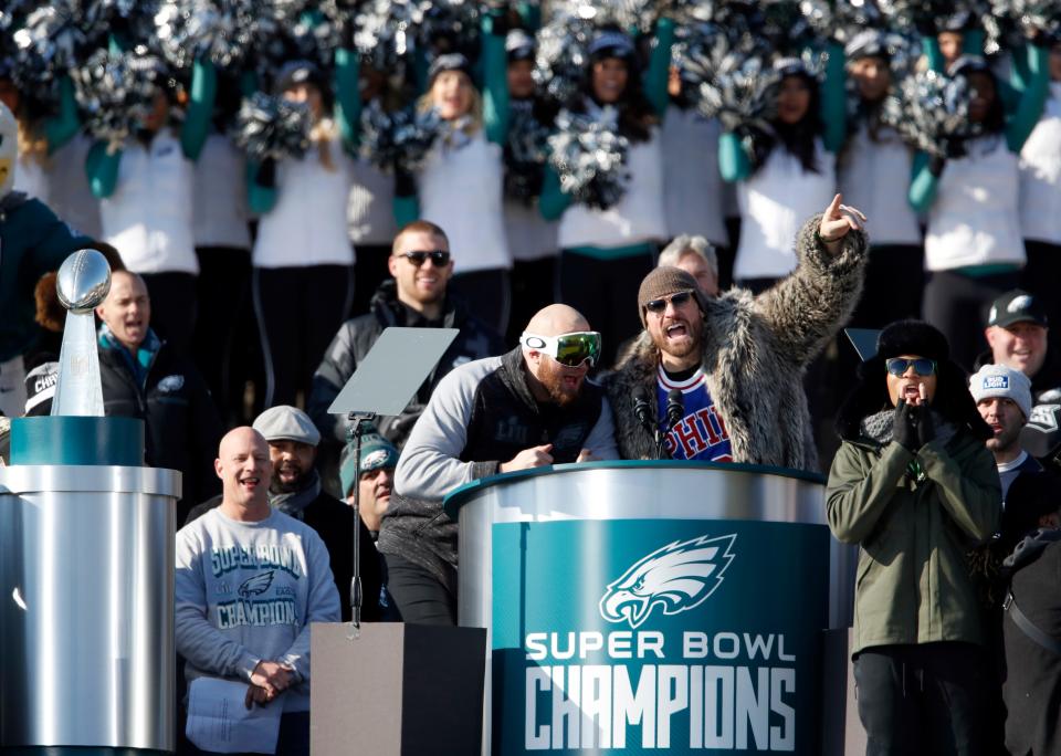 Eagles offensive tackle Lane Johnson (left) and defensive end Chris Long speak in front of the Philadelphia Museum of Art after the Super Bowl victory parade in 2018.