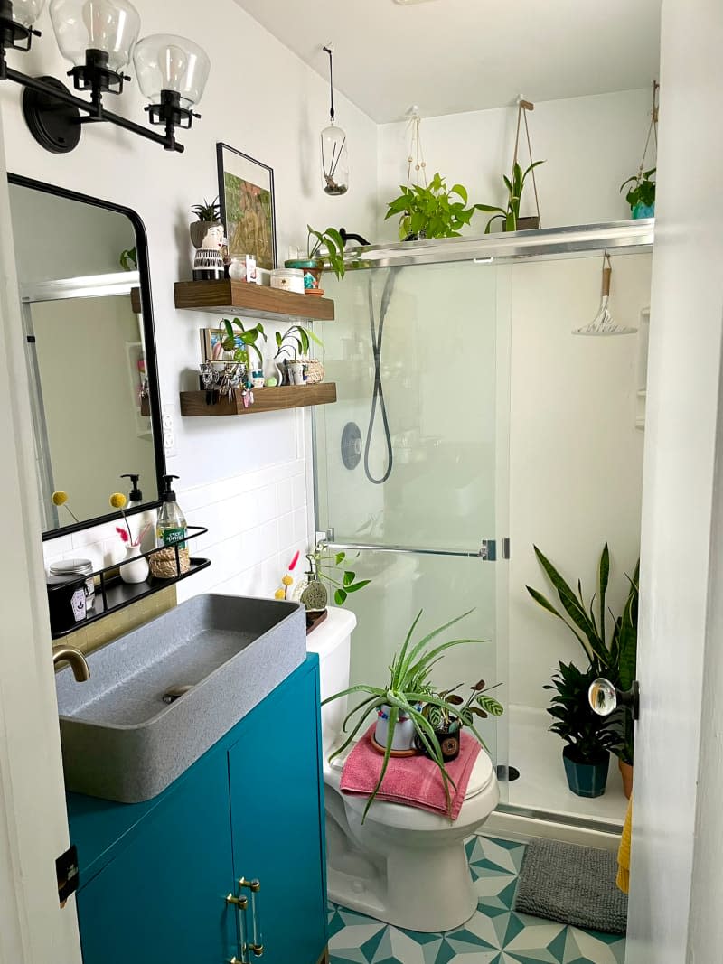 Plant filled bathroom.