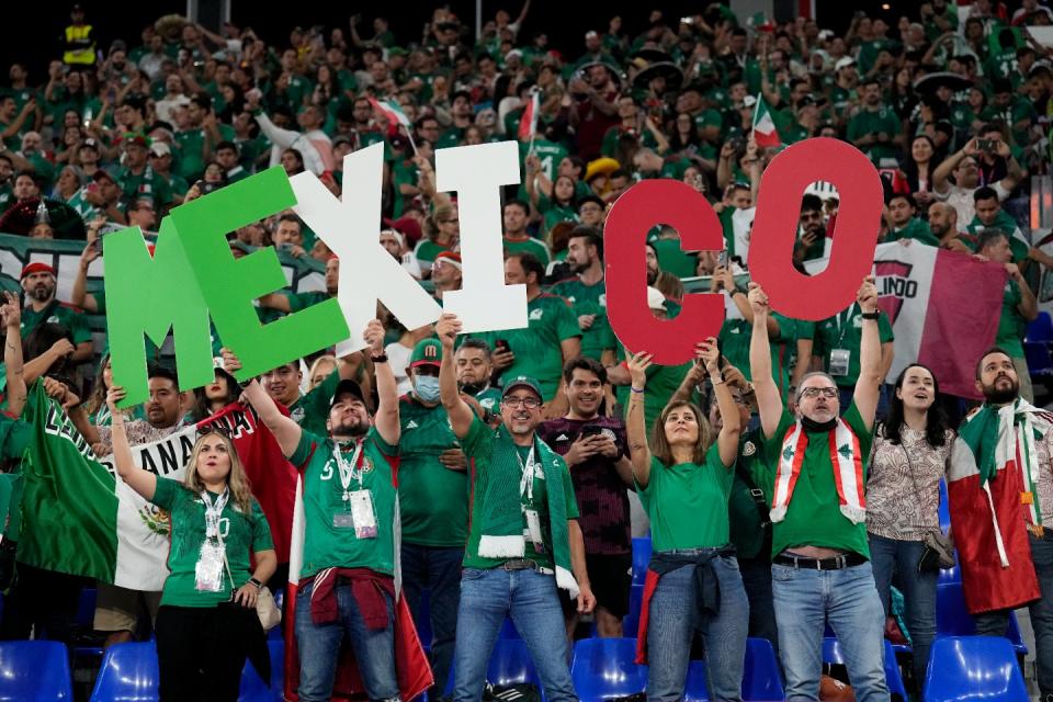 Fans of Mexico cheer during a World Cup group C football match against Poland at the Stadium 974 in Doha, Qatar, Tuesday, Nov. 22, 2022. (AP Photo/Martin Meissner)