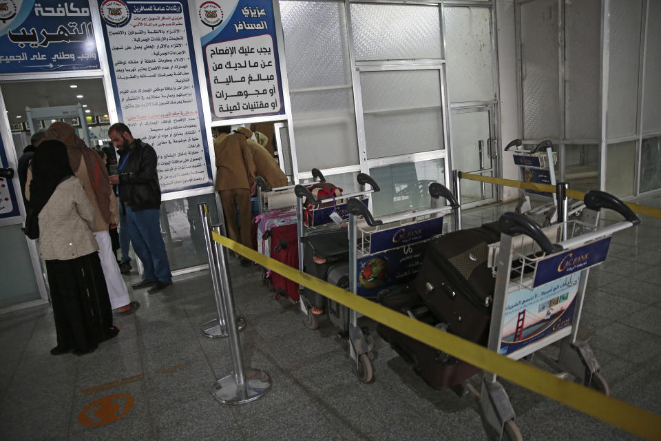 Yemenis queue at the departure lounge to board the first commercial flight at Sanaa airport, Yemen, Monday, May, 16, 2022. The first commercial flight in six years took off from Yemen’s rebel-held capital on Monday, officials said, part of a fragile truce in the county’s grinding civil war.(AP Photo/Hani Mohammed)