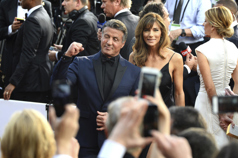 FILE - Sylvester Stallone, left, and Jennifer Flavin arrive at the Oscars on Sunday, Feb. 28, 2016, at the Dolby Theatre in Los Angeles. Stallone's wife Jennifer Flavin Stallone has filed for divorce after 25 years of marriage. She filed a petition to end the marriage last week in a court in Palm Beach County, Fla., where the couple owns a home. (Photo by Al Powers/Invision/AP, File)