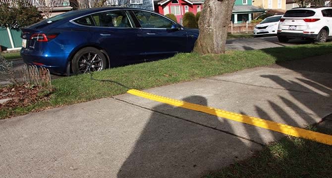 This is an example of the City of Vancouver's cord covers used to charge electric vehicles at homes that don't have driveways or garages. 