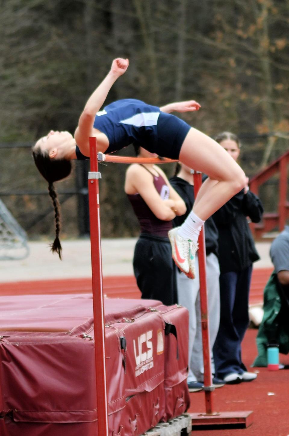 Quabbin senior Natalia Marchand clears the high jump bar during a meet.