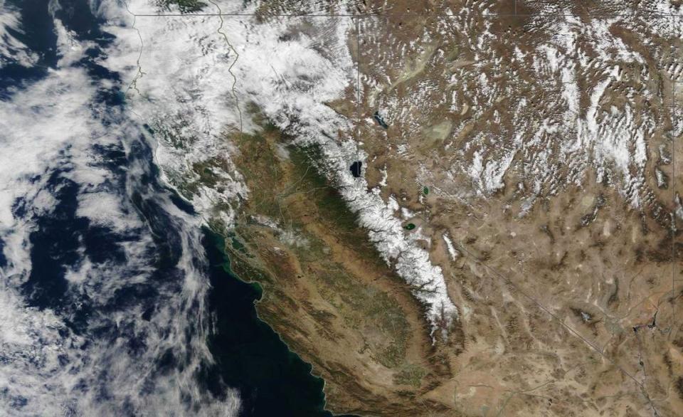 Northern California is seen Oct. 27, 2021, in a MODIS Corrected Reflectance satellite composite image produced by NASA’s Earth Observing System Data and Information System. A before-and-after view of the imagery shows the striking change to the Sierra Nevada following a historic storm that swept across Northern California over the week.