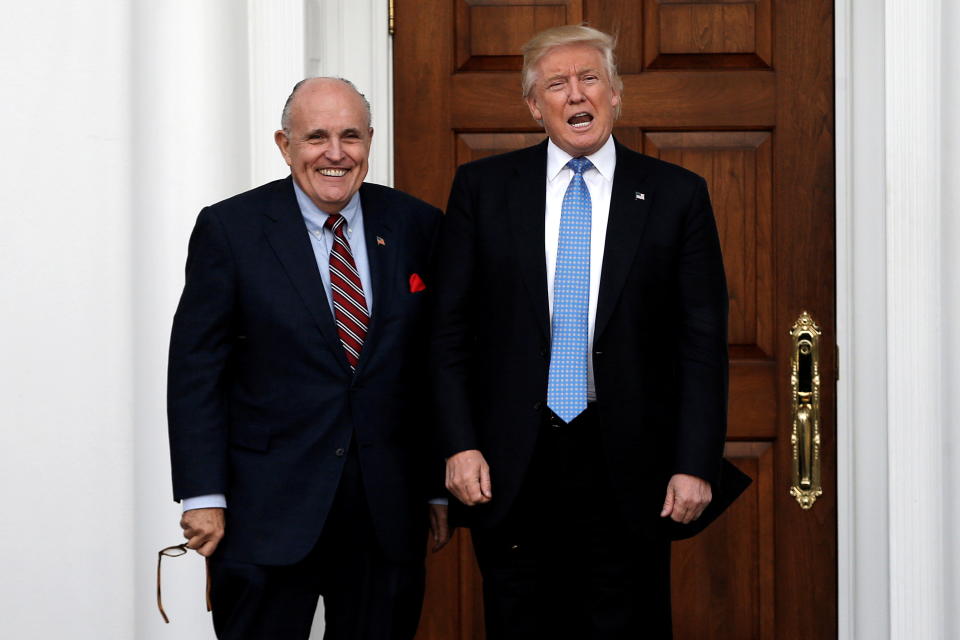 U.S. President-elect Donald Trump stands with former New York City Mayor Rudolph Giuliani before their meeting at Trump National Golf Club in Bedminster, New Jersey, U.S., November 20, 2016.  (Mike Segar/Reuters)