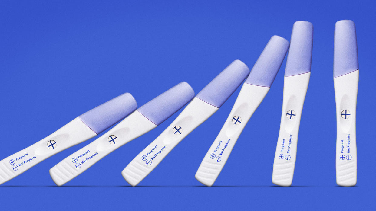  Pregnancy tests toppling in a row. 