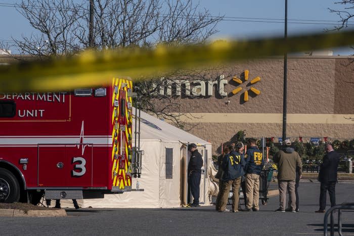 Members of the FBI and other law enforcement investigate the site of a fatal shooting in a Walmart on Nov. 23 in Chesapeake, Virginia.